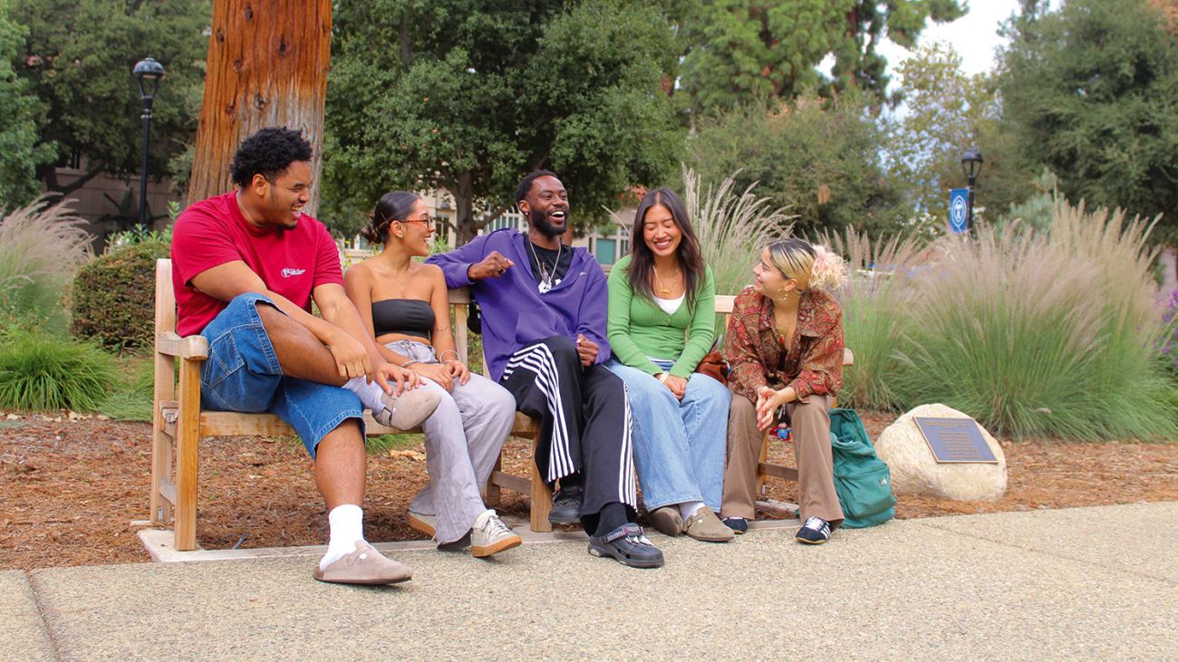 Pomona students sitting on the Round Robin bench