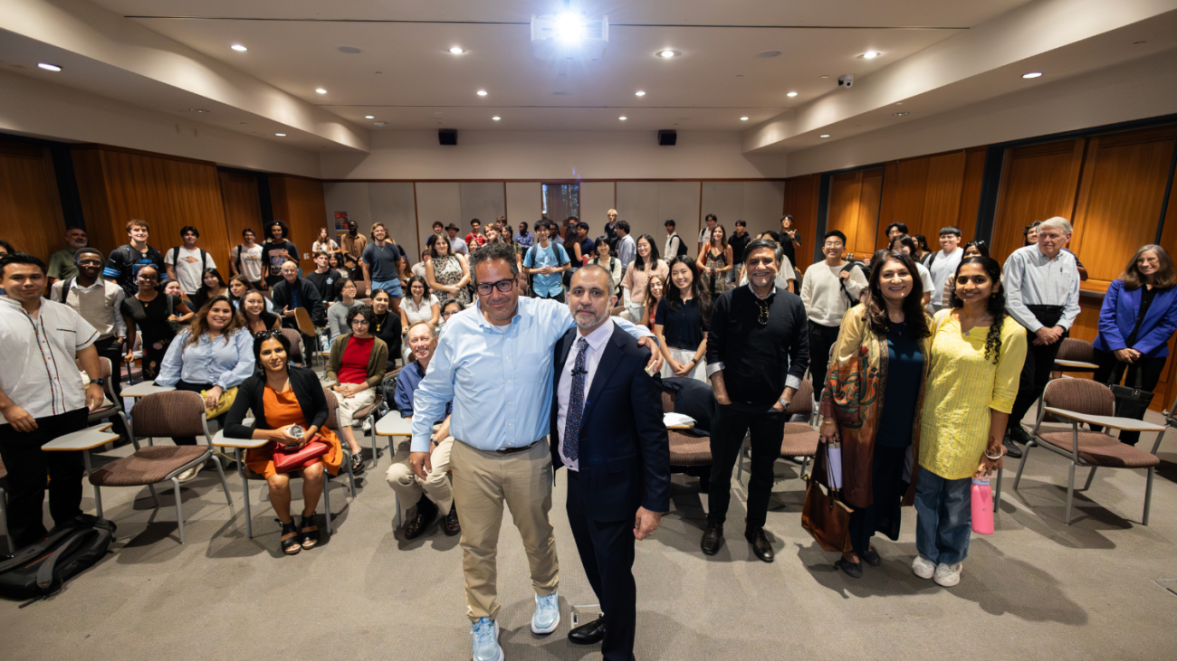Professor Lozano and Asim Ijaz Khwaja pose with the lecture audience in Hahn Hall