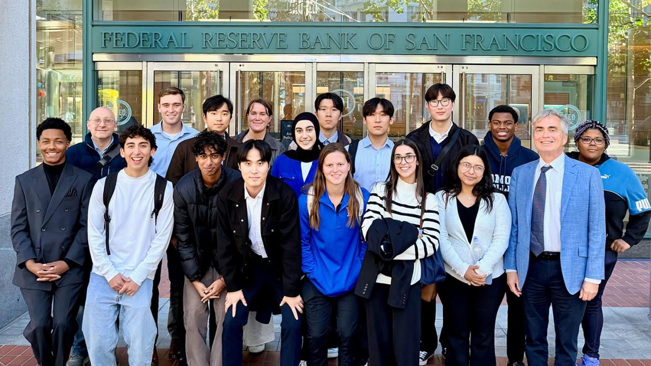 Economics class in front of the San Francisco Fed sign
