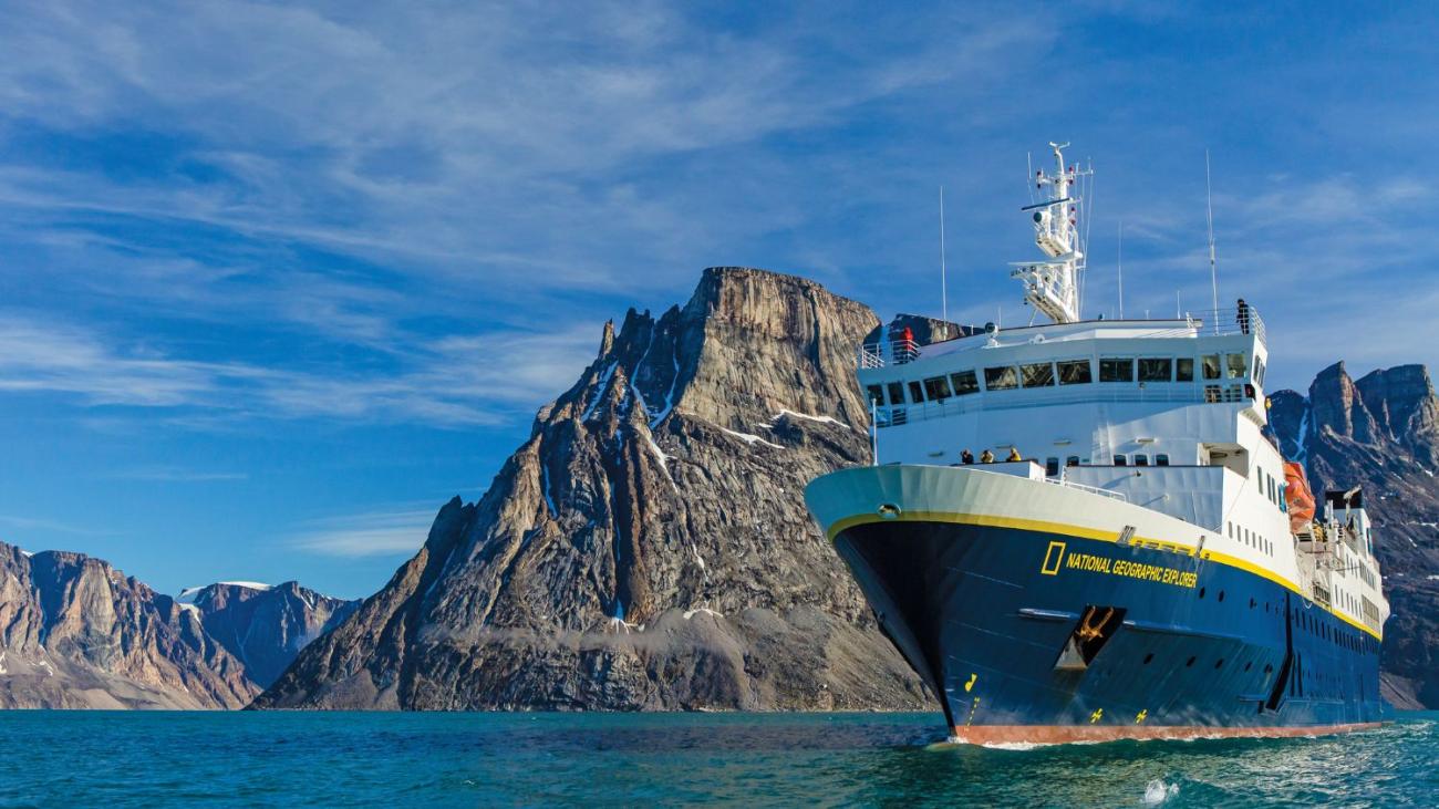 Cruise ship in front of Greenland mountains