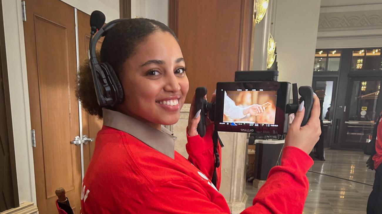 Amirah Adem holds a camera