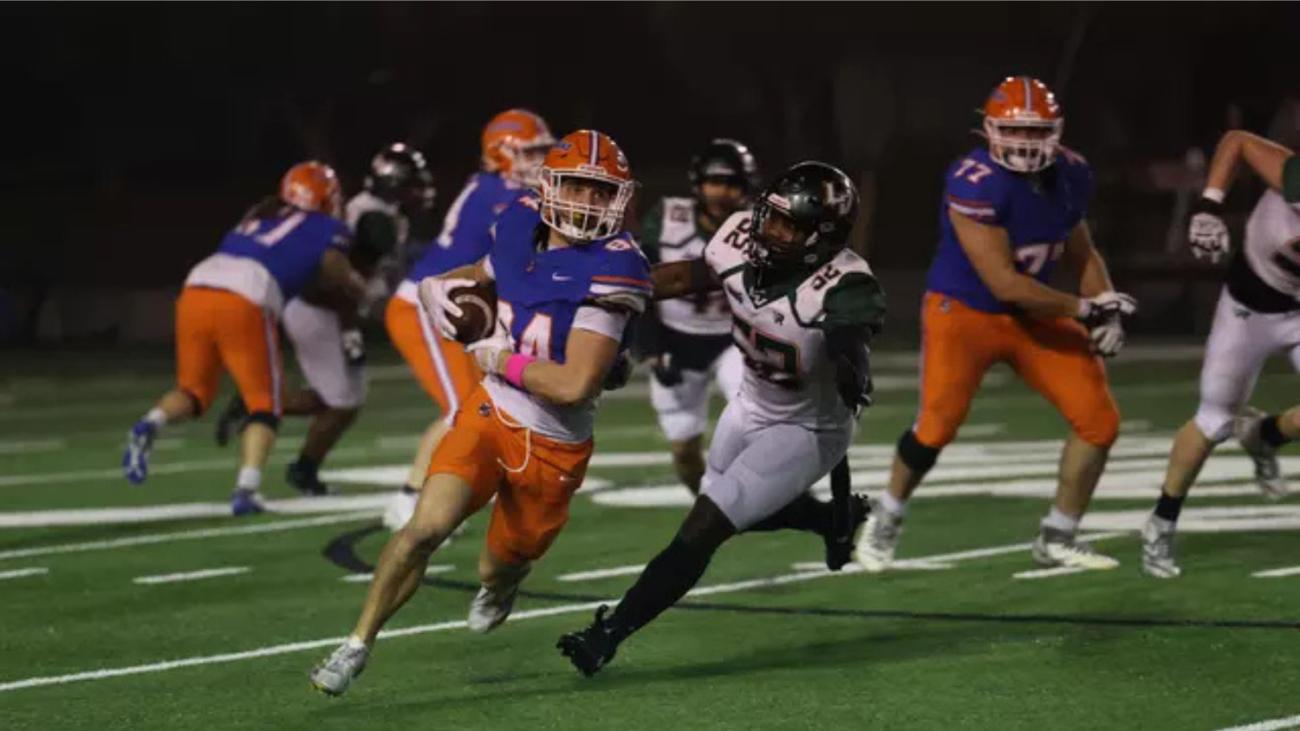 Football players mid-game