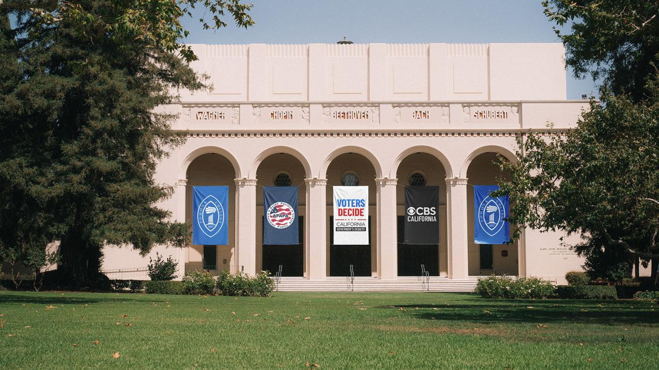 Bridges Auditorium with Pomona College, APAPA, Voters Decide, and CBS California banners