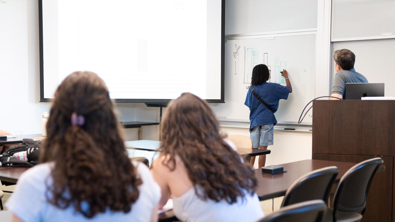 Professor Adam Pearson with students in class