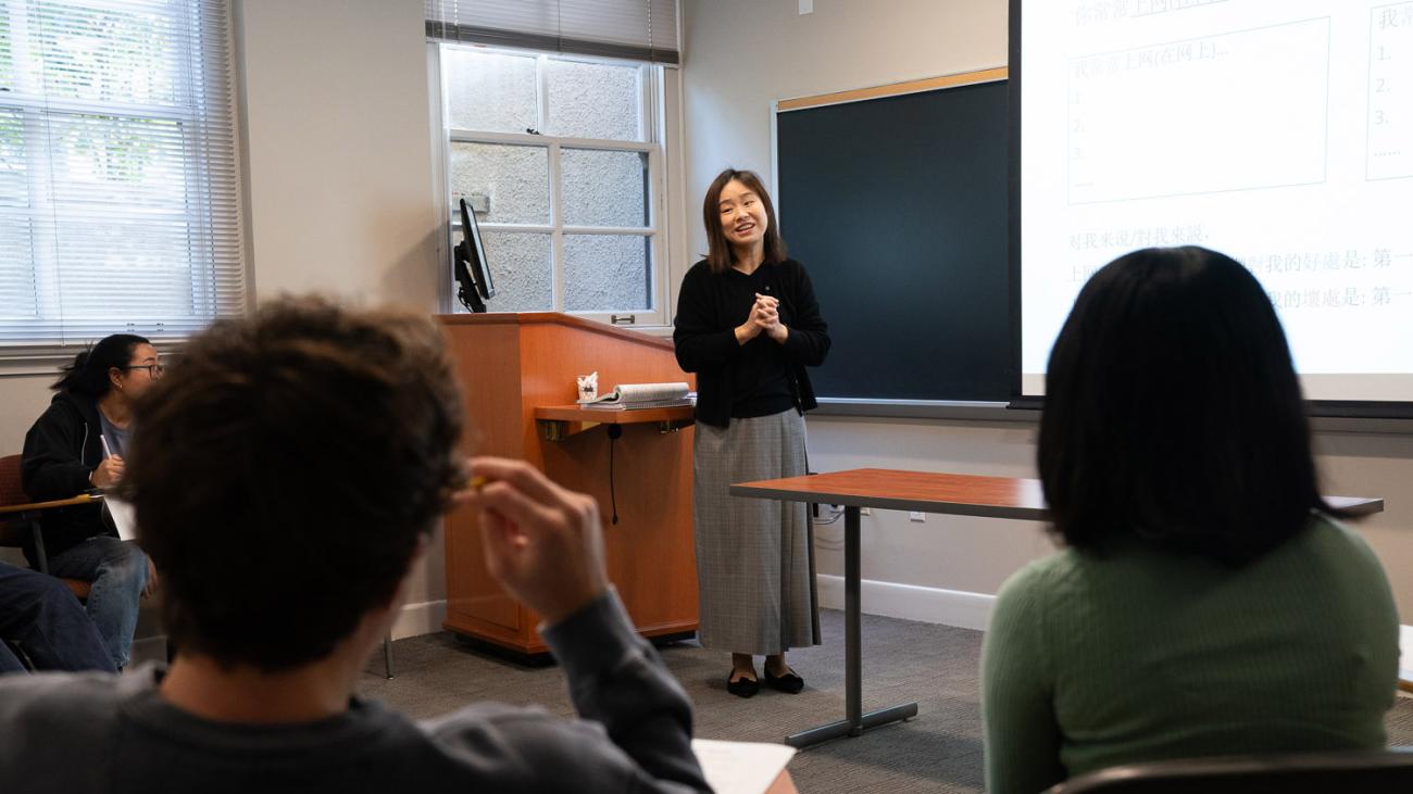 Prof. Kun Nie standing in front of class