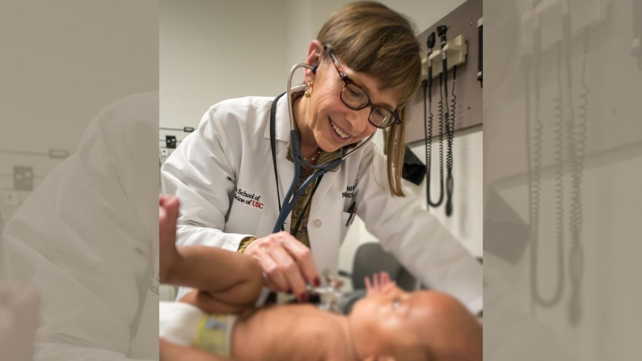 Pamela Shcaff checking heartbeat of baby 