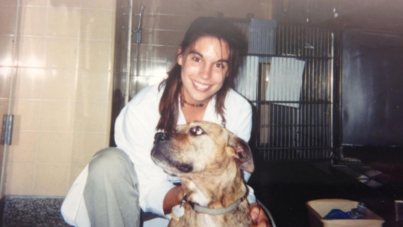 Smith with a dog during vet school in 2000