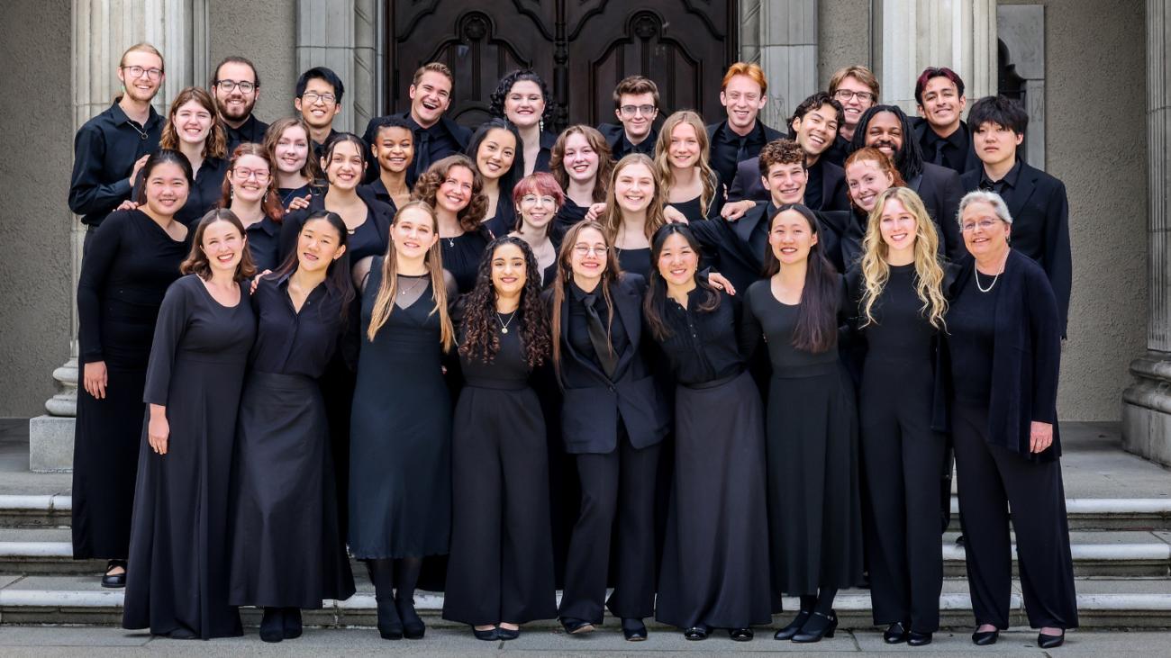 34-member Glee Club and Prof. Donna M. Di Grazia on the steps of Bridges Hall of Music