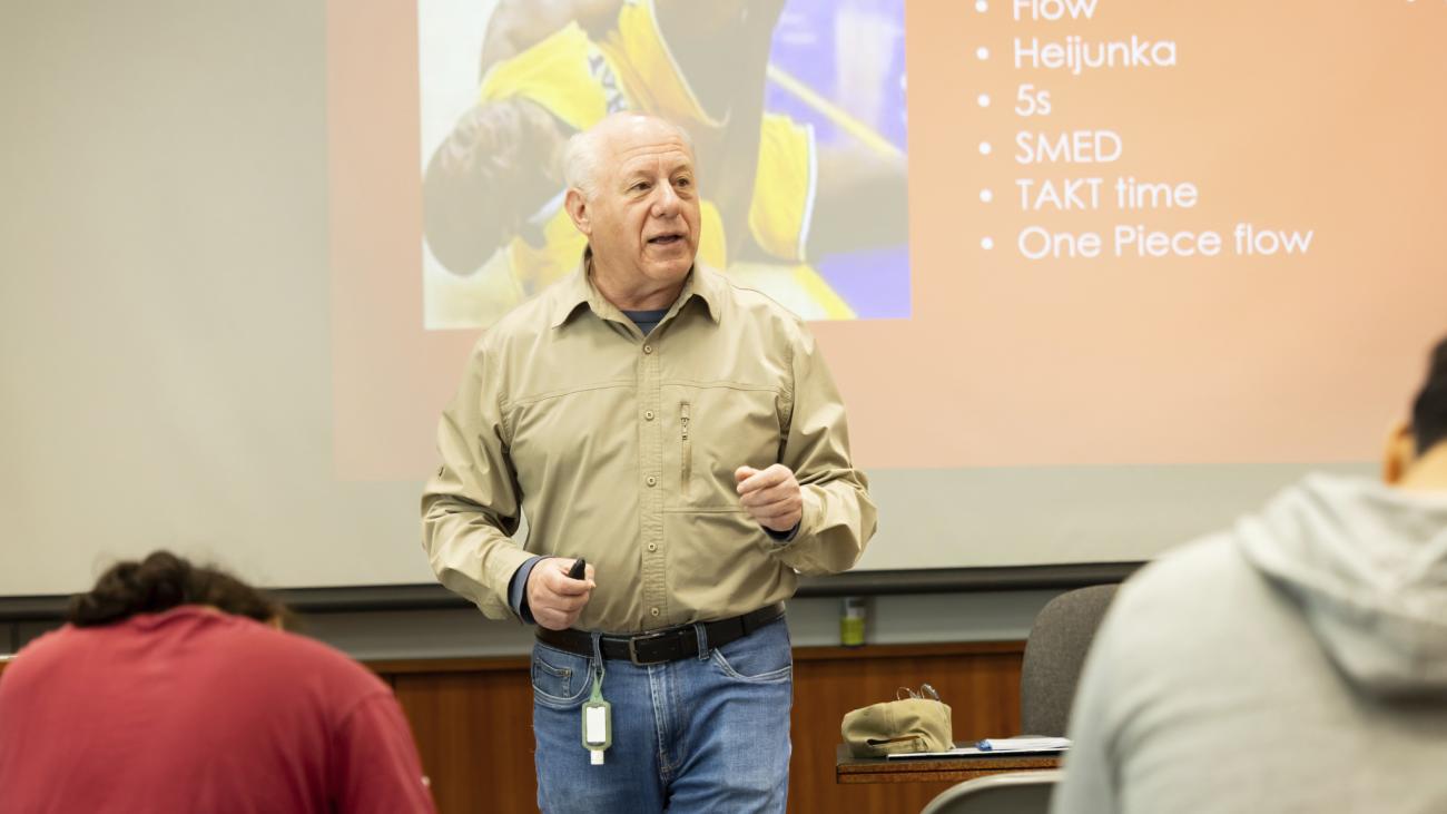 A man in front of a class