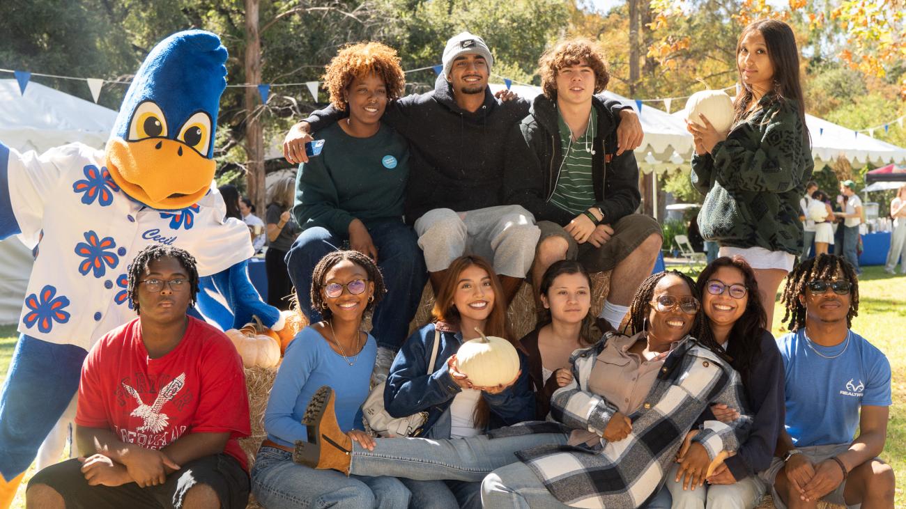 Students posing with Cecil at Founders Day