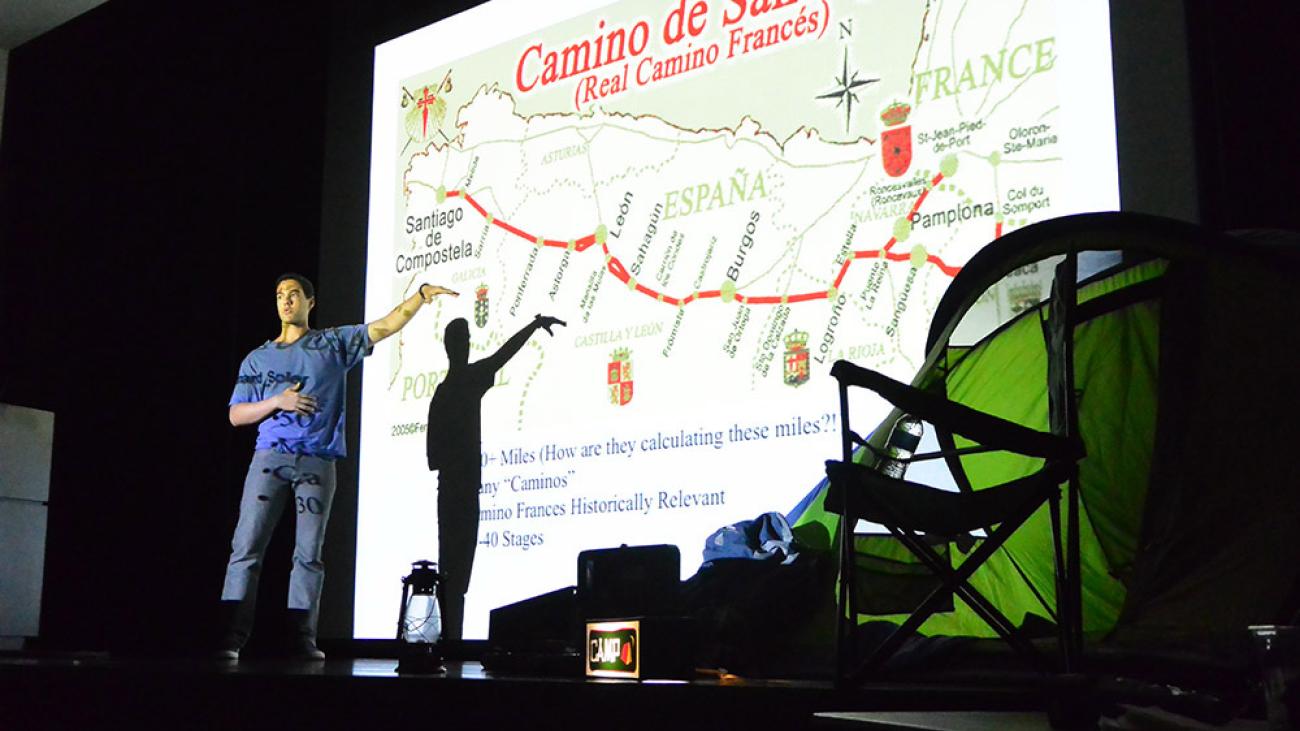 A student giving a presentation on Camino de Santiago