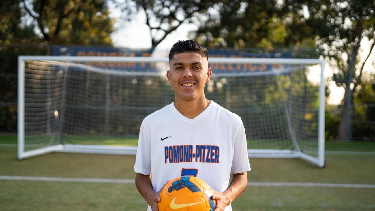 Jorge Guillen Lopez holds a soccer ball.