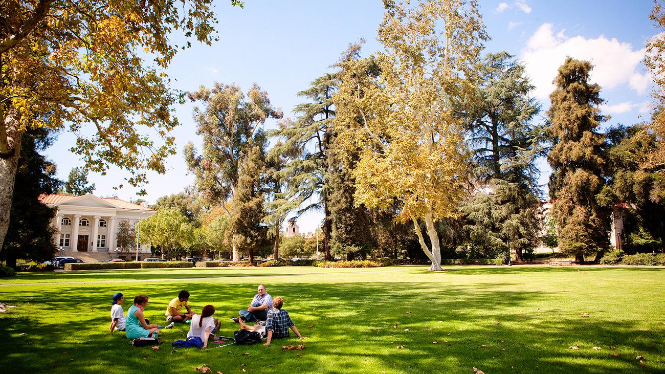 A class is held outdoors on beautiful Marston Quad.