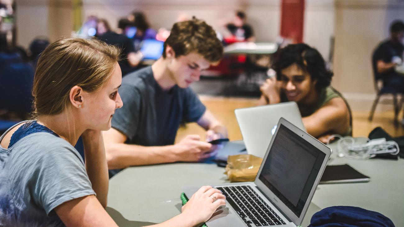 Students working at overnight Hackathon event