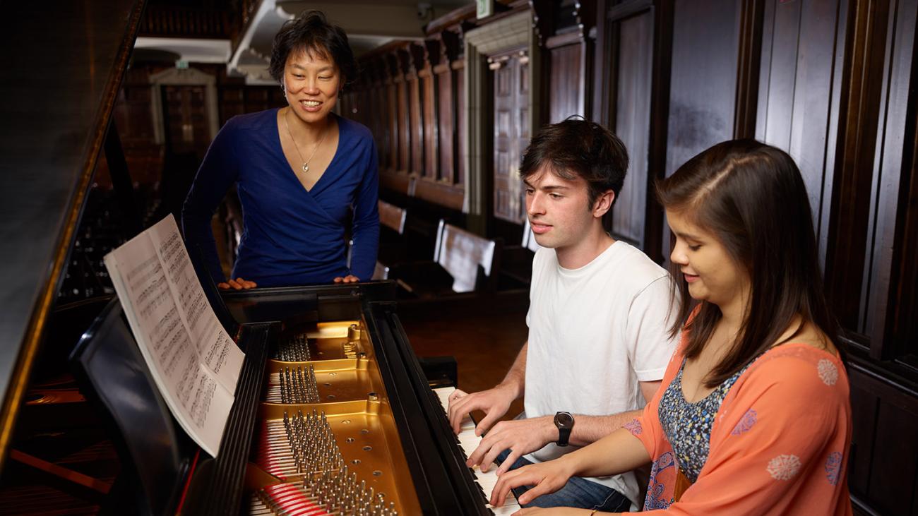 Music students playing piano