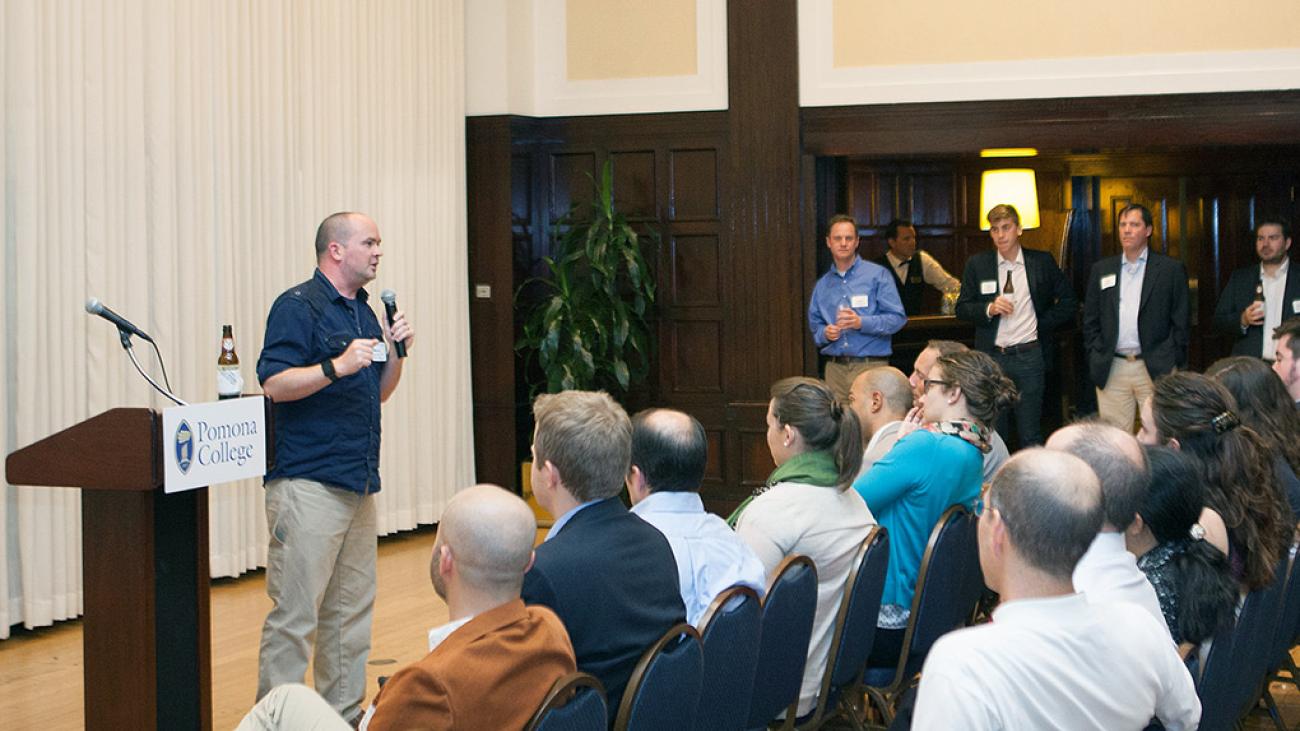 Mikey Dickerson '01 speaking at a Pomona College alumni networking event